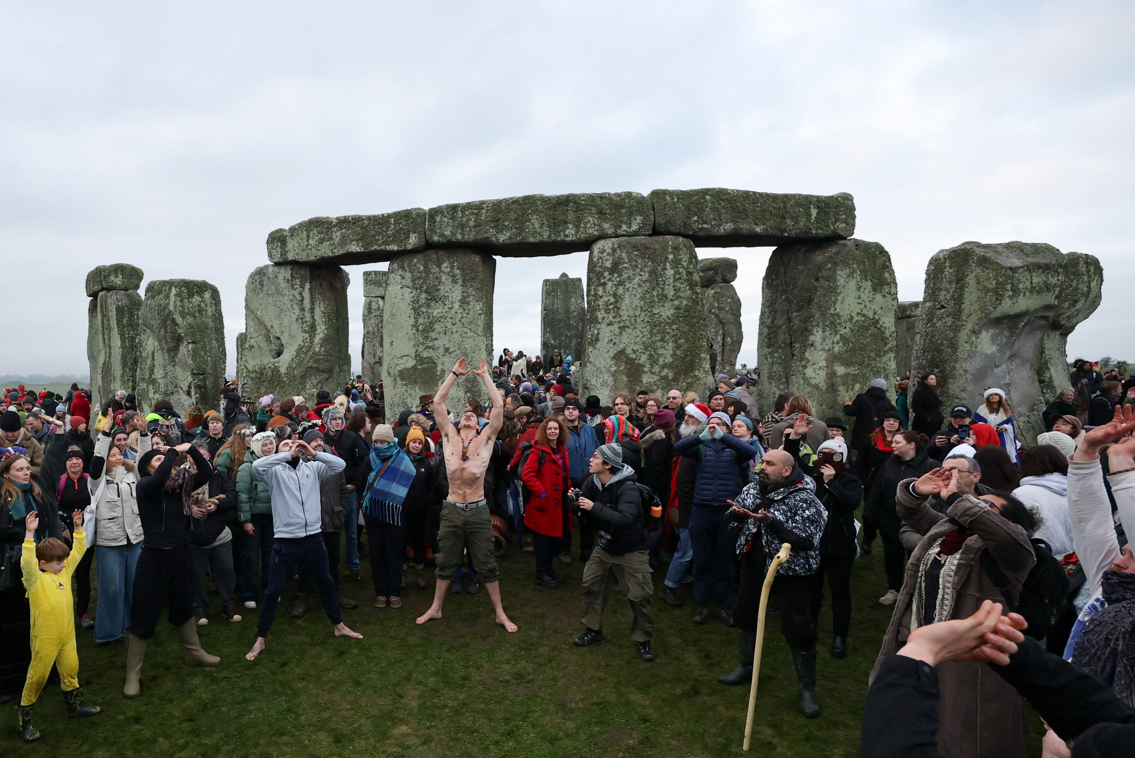 Revellers do yoga as they attend winter solstice celebrations at the Stonehenge stone circle. Reuters