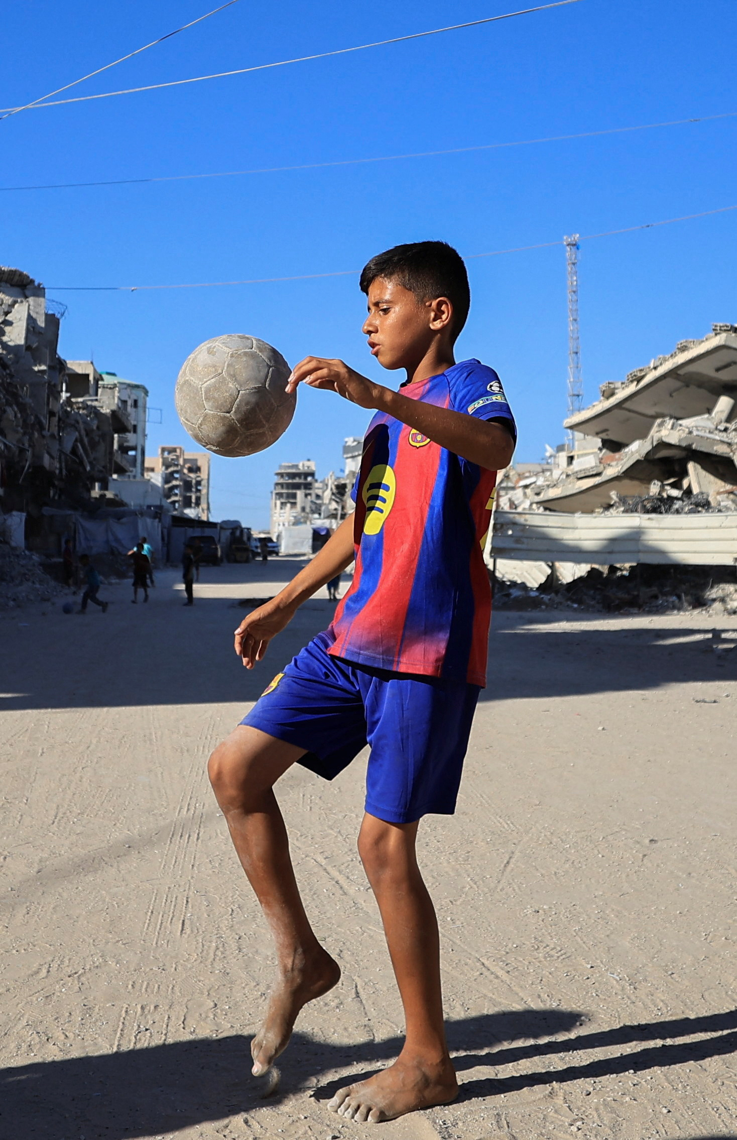 Gazans displaced by war watch World Cup from the ruins