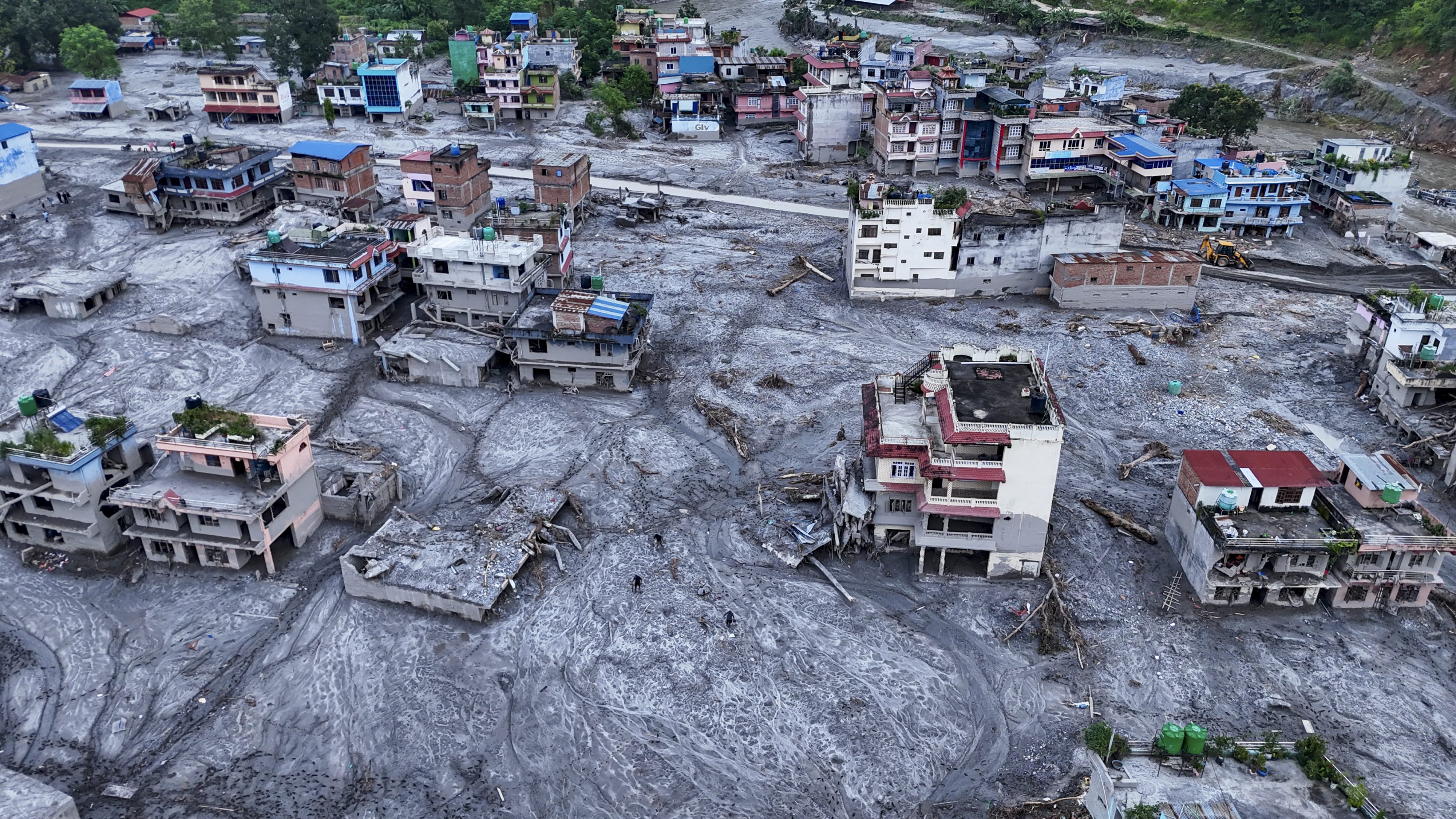 Through mud & memories, Nepal searches for those lost