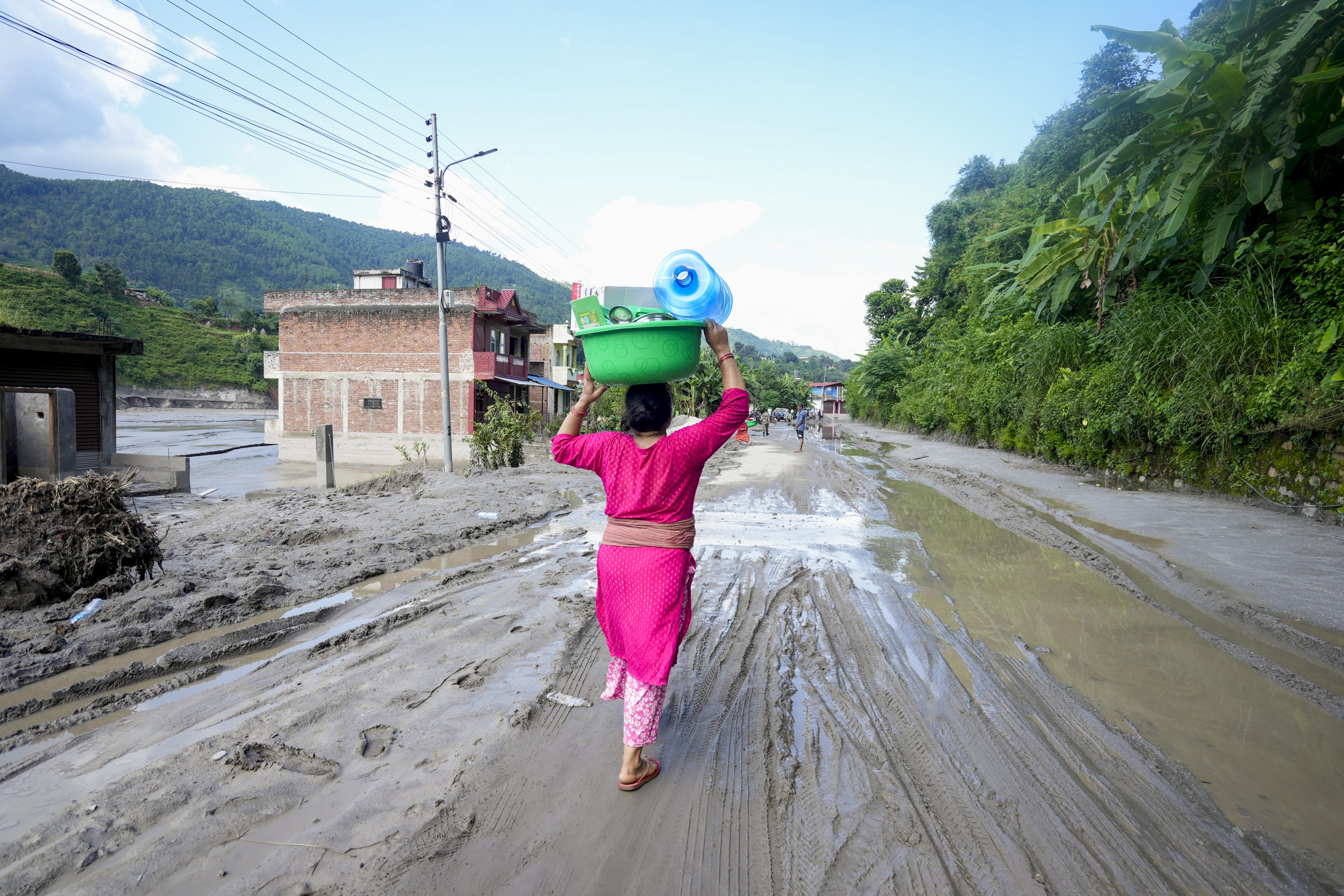 ‘We will rebuild it’: Families pick up pieces, try to rebuild lives after Nepal floods