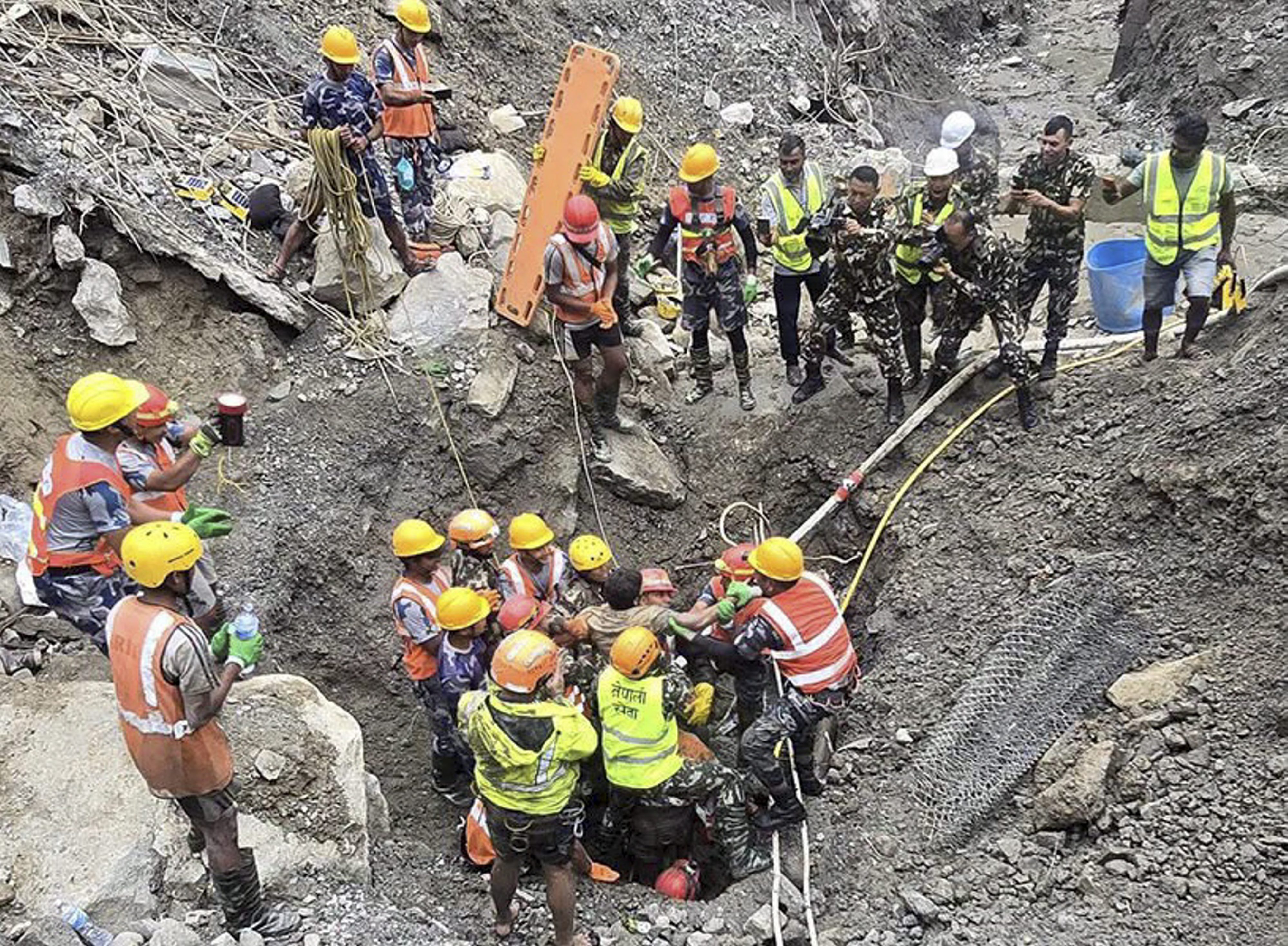 Two workers rescued alive from hydropower tunnel 10 days after Nepal flash floods